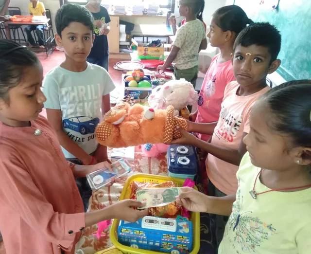 Young entrepreneurs from Salem's top CBSE school manage a toyshop, demonstrating practical statement problems for grade 3 multiplication skills in a lively classroom market setup.