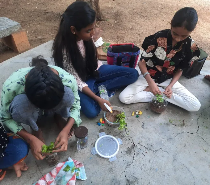 Grade 7 Terrarium activity 6_result Engaged learning as a student from a top school in Salem plants greenery in a terrarium.