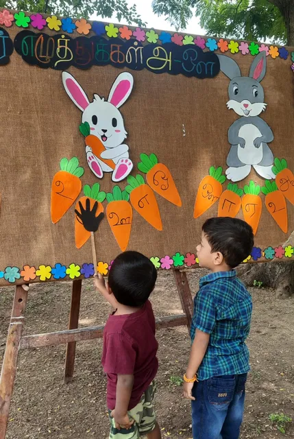 LKG students at the best CBSE school in Salem engaging with Tamil 'உயிர் எழுத்துக்கள்' learning activity.