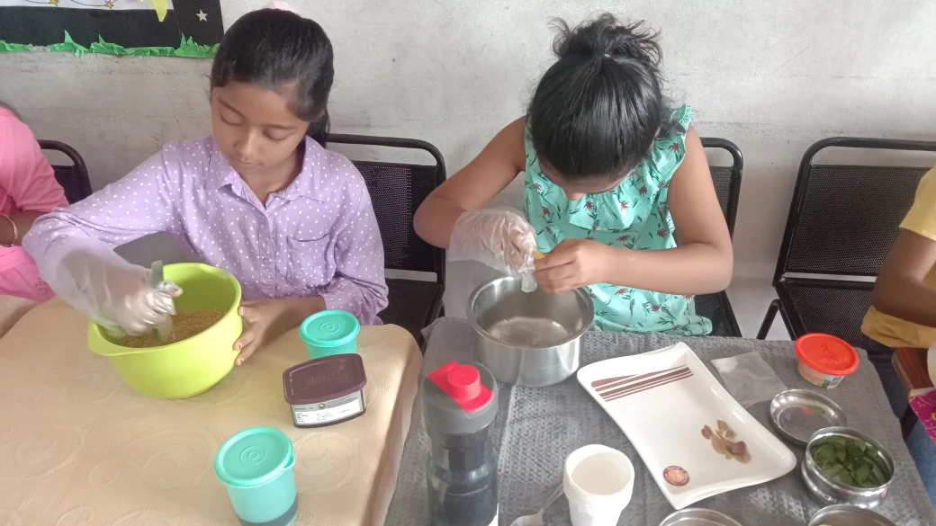 Grade 3 pupils from a leading Salem CBSE school artistically arranging and garnishing their flameless culinary creations, highlighting their skill in healthy food preparation.