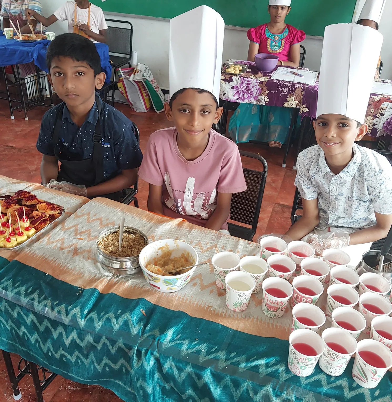 Young chefs with their traditional South Indian dishes at Vidhya Peetham i-School's flameless cooking activity.
