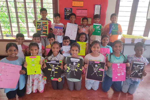 Young students showcase their artistic interpretation of the human skeleton in a classroom activity at a Salem school.
