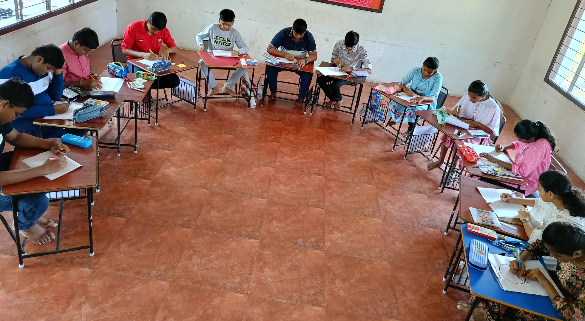 Focused students of Vidhya Peetham i-School immerse in their artwork during the Brush and Beyond activity