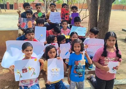 Grade 3 students proudly displaying their cotton bud art creations at a CBSE school in Salem.