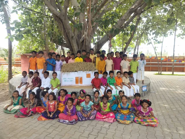 Group photo of children dressed in traditional attire after playing games.