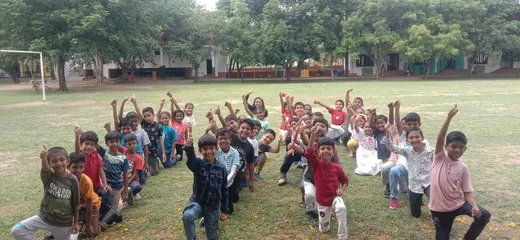 Grade 3 students posing excitedly after completing the Roman Numbers activity