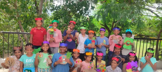 Group of students proudly showing their jute crafts creations.