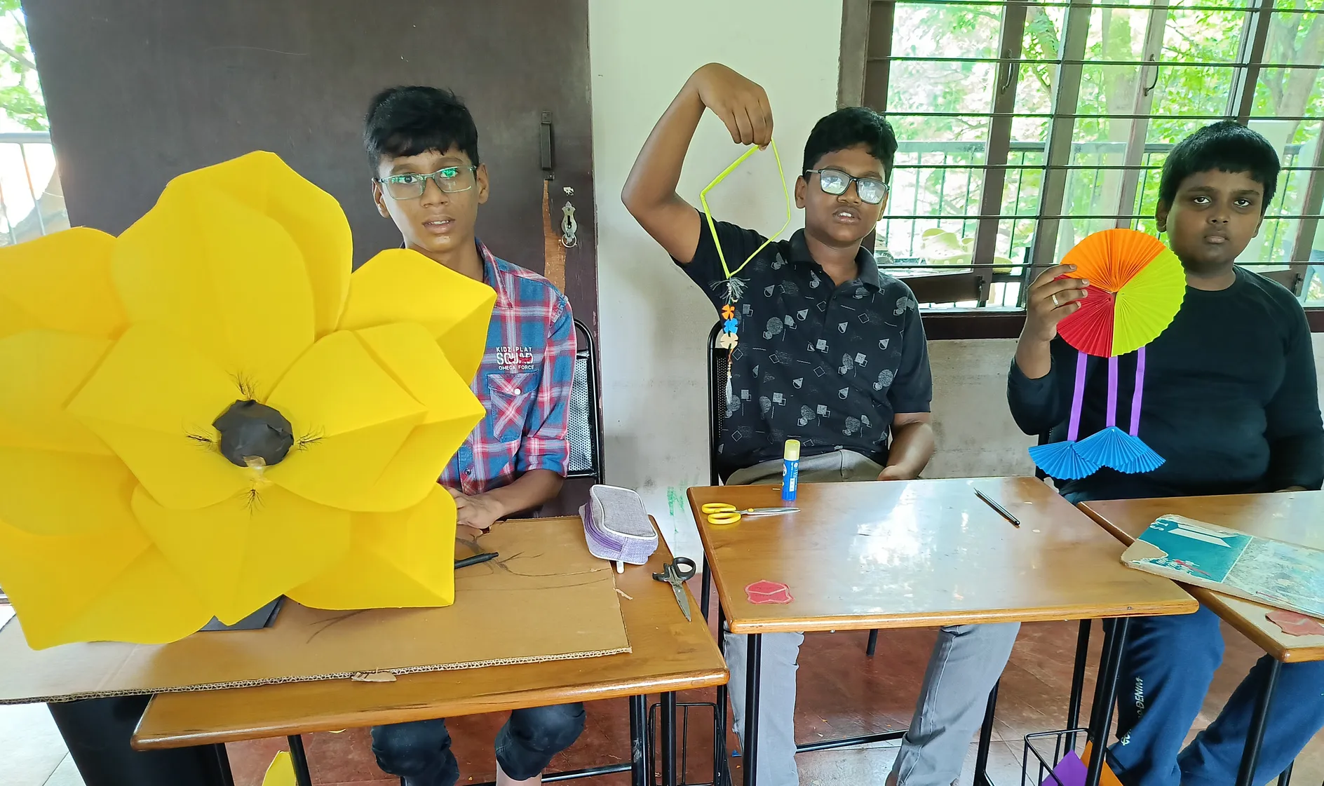 Grade 8 students showcasing their creative wall hangings at a CBSE school in Salem.