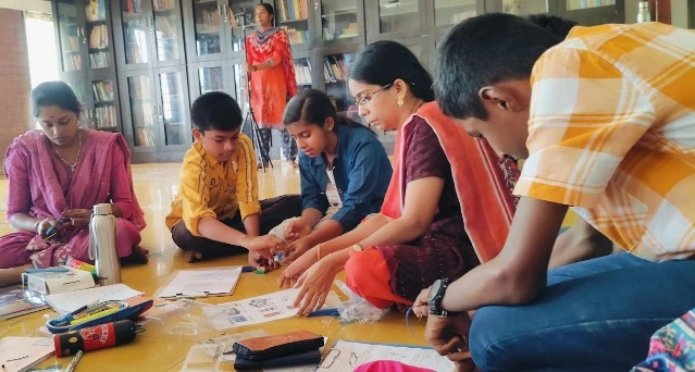 Students engaged in a kirigami activity, enhancing their concentration and creativity at a Salem school.