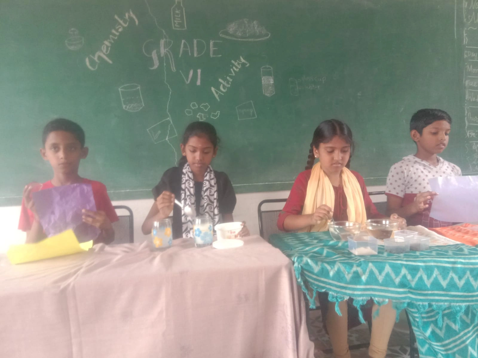 Young learners conducting experiments with various materials in classroom setting