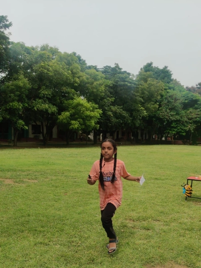 Enthusiastic student racing ahead to form Tamil words based on picture prompts