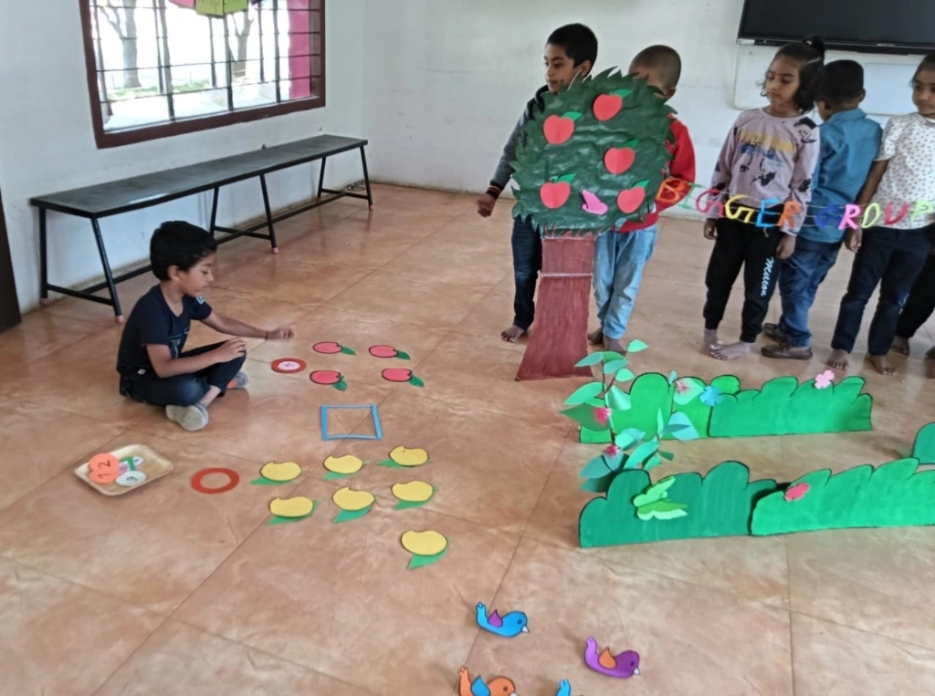 Garden-themed mathematics activity setup with students practicing bigger number concepts