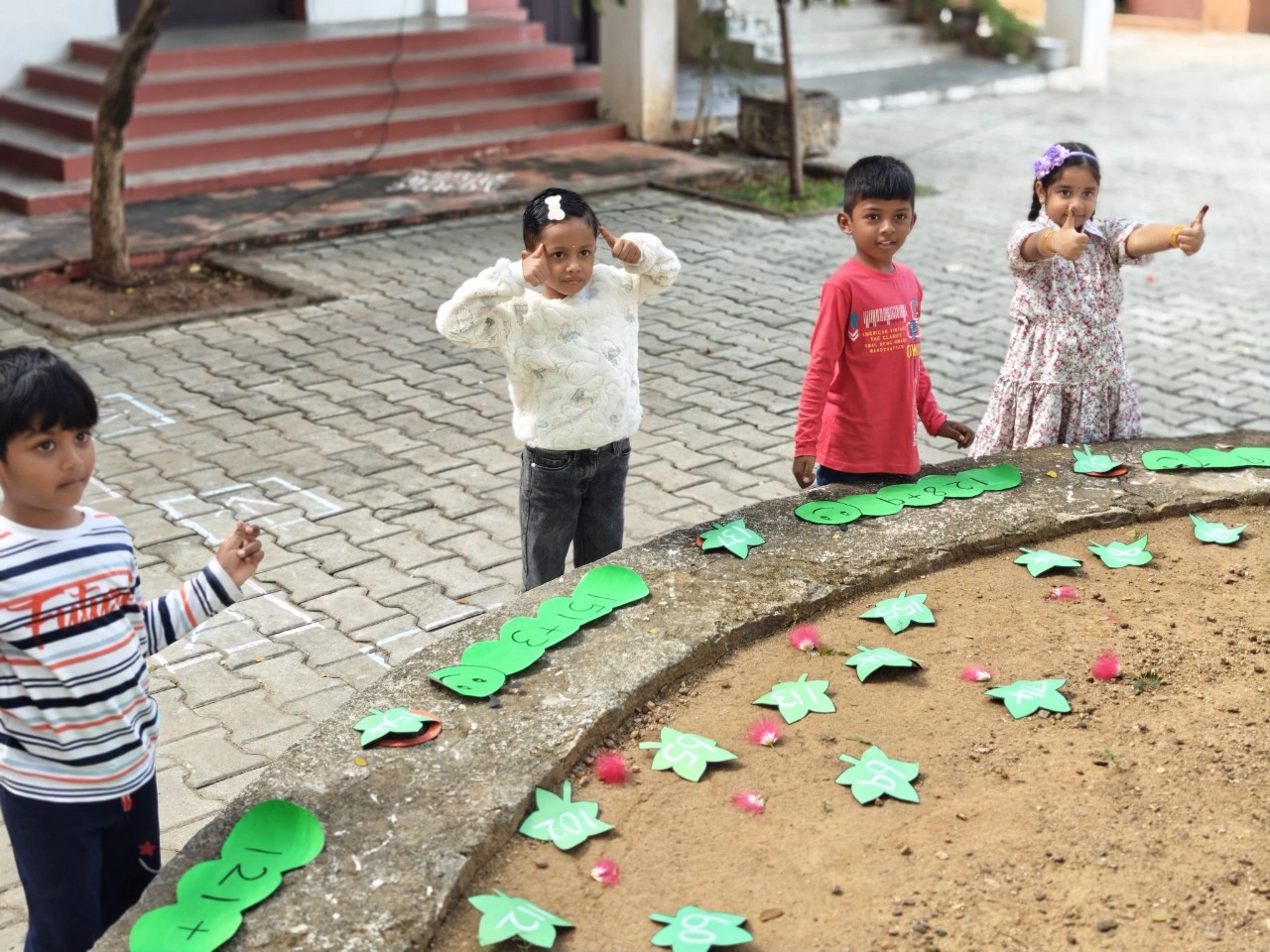 Group of UKG students celebrating their success in horizontal addition activities