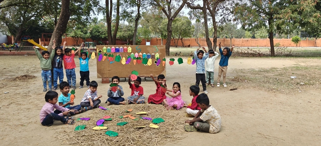 Students celebrating successful completion of missing number identification task