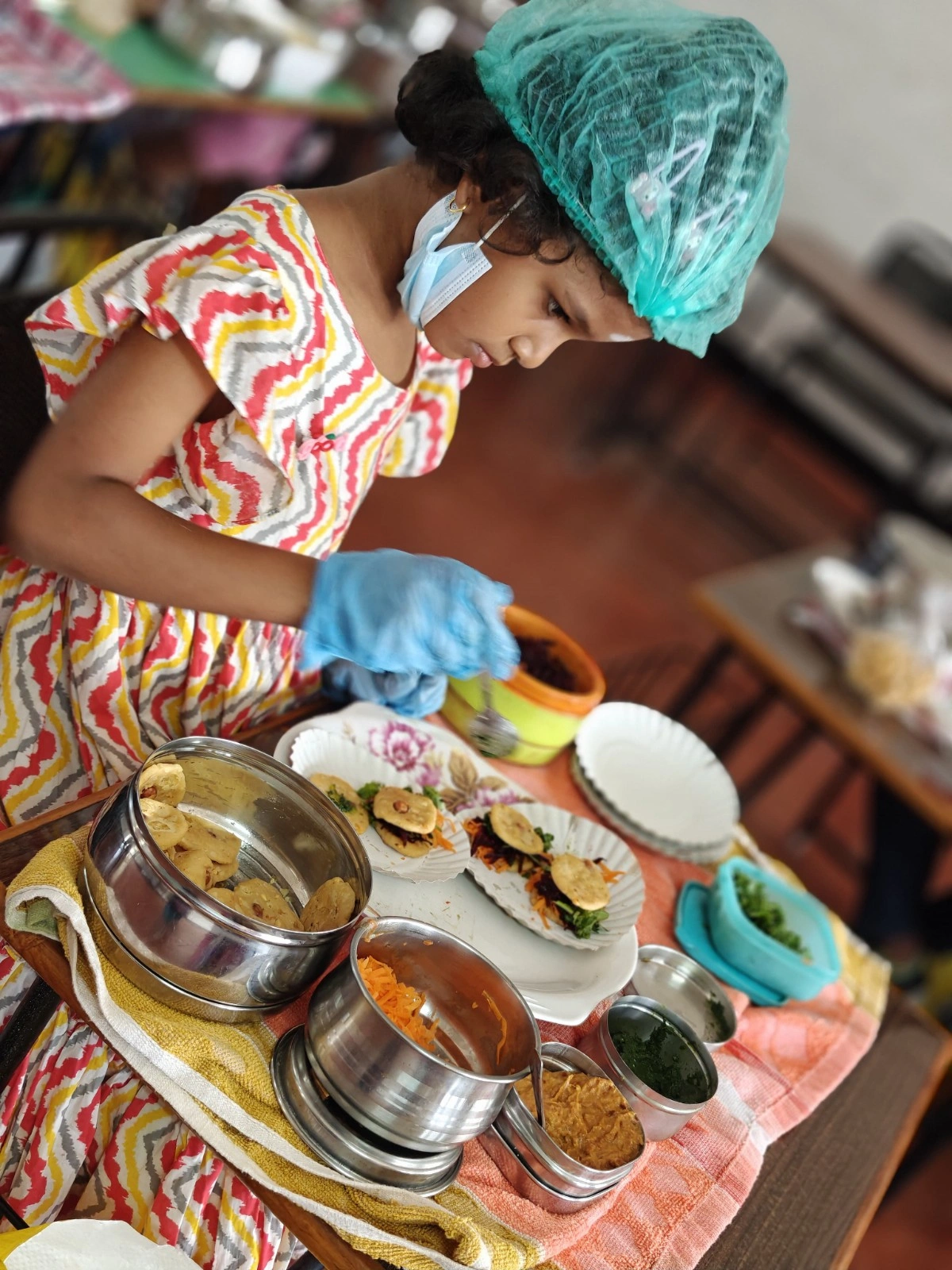 Student in colorful attire carefully preparing healthy ingredients for cooking