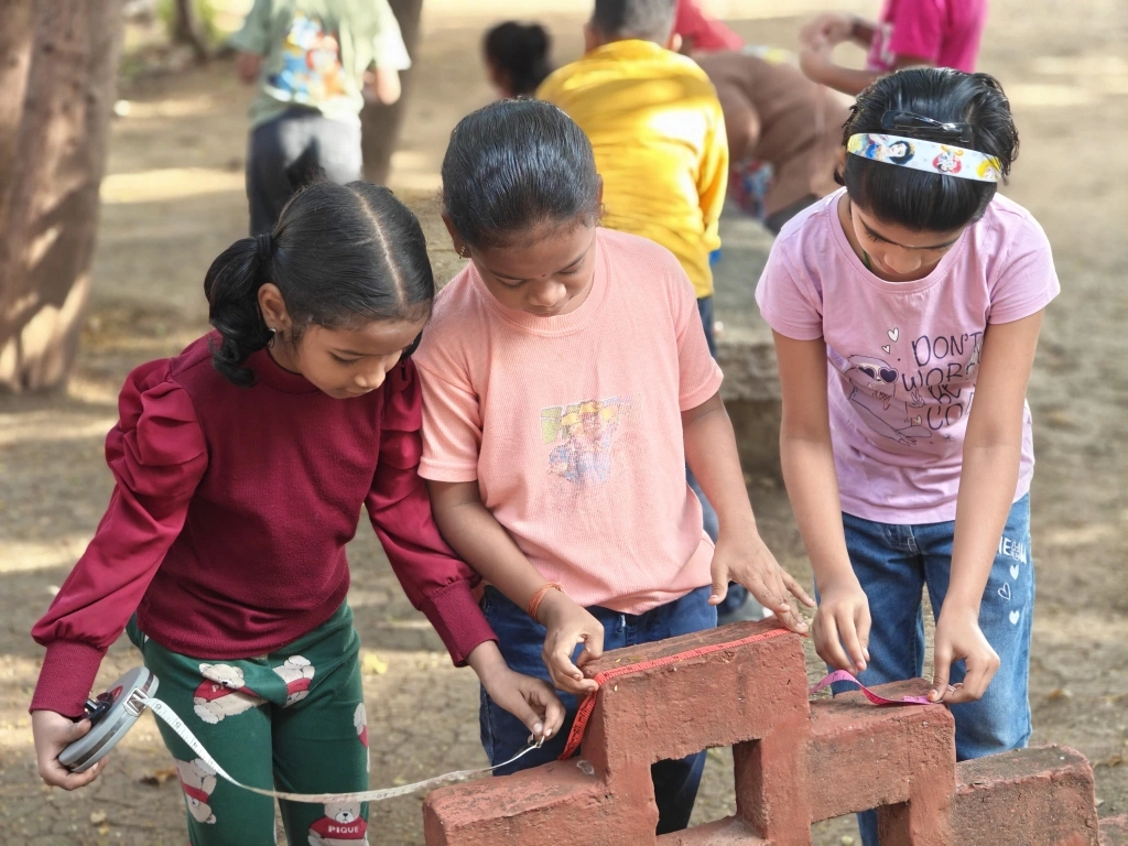 Students working together to measure brick dimensions