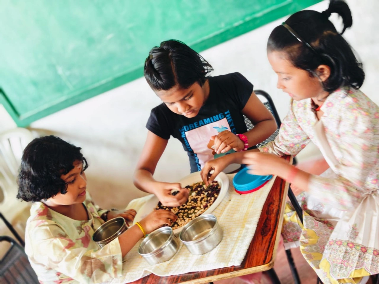 Students at Vidhya Peetham i-School carefully separating mixtures components during science experiment
