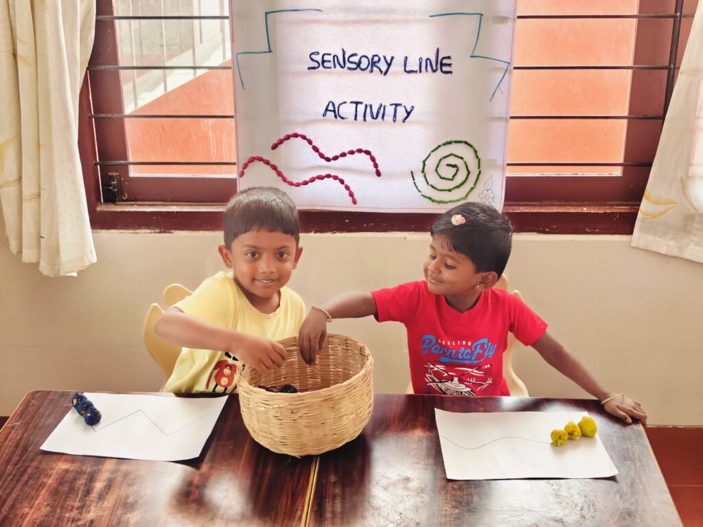 Two children reach into a woven basket, with zigzag and wavy lines drawn on their papers.